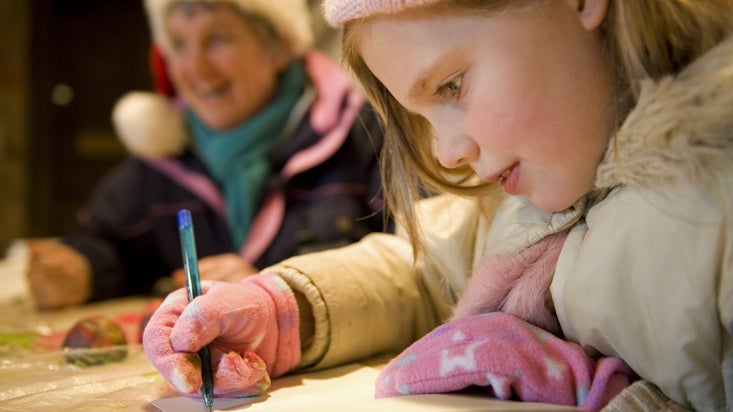 Child making Christmas cards